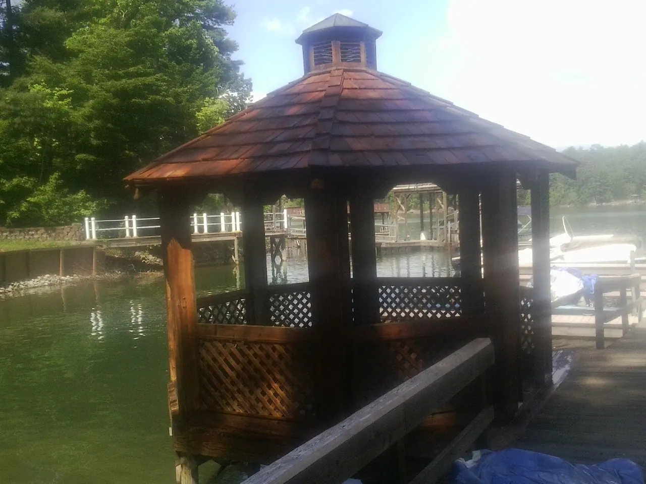 Cedar shake gazebo roof rebuilt on a lake dock in Powells Point